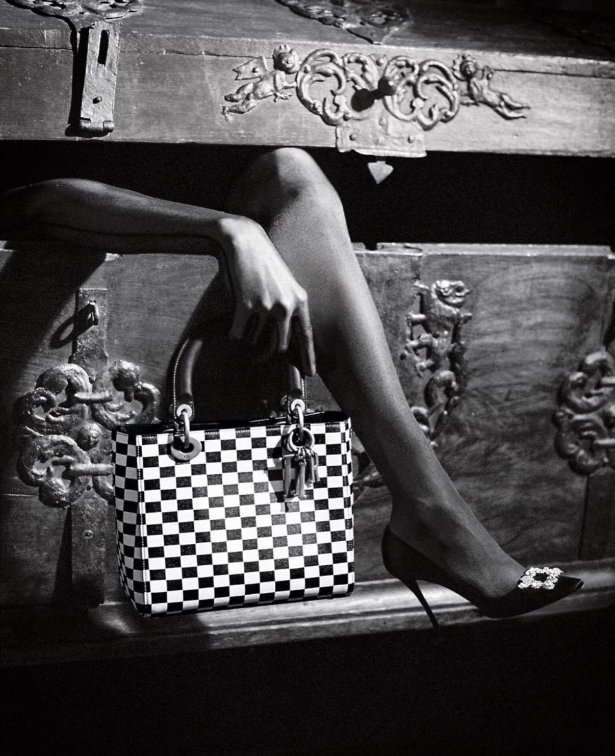 Black and white accessories still life, handbag and heels
